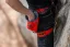 Adam Ondra chalking up while climbing with his Mammut Sender Light Chalk Bag