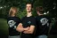 Adam Ondra and two models posing in the AO "I hate toehooks" black T-shirt