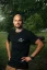 A man model posing in Adam Ondra "I hate toehooks" black T-shirt