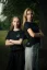 Two women posing in Adam Ondra "I hate toehooks" black T-shirt, front side