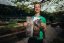 Adam Ondra holding his Circus Maximus poster, portrait version